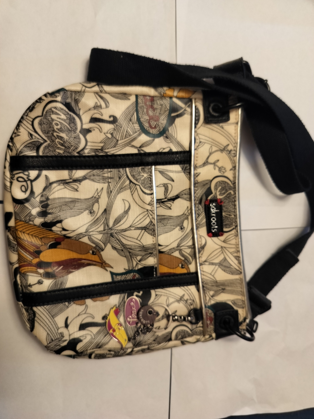 Sakroots Cream Illustrated Messenger Bag with Black Strap and Multicolor Accents